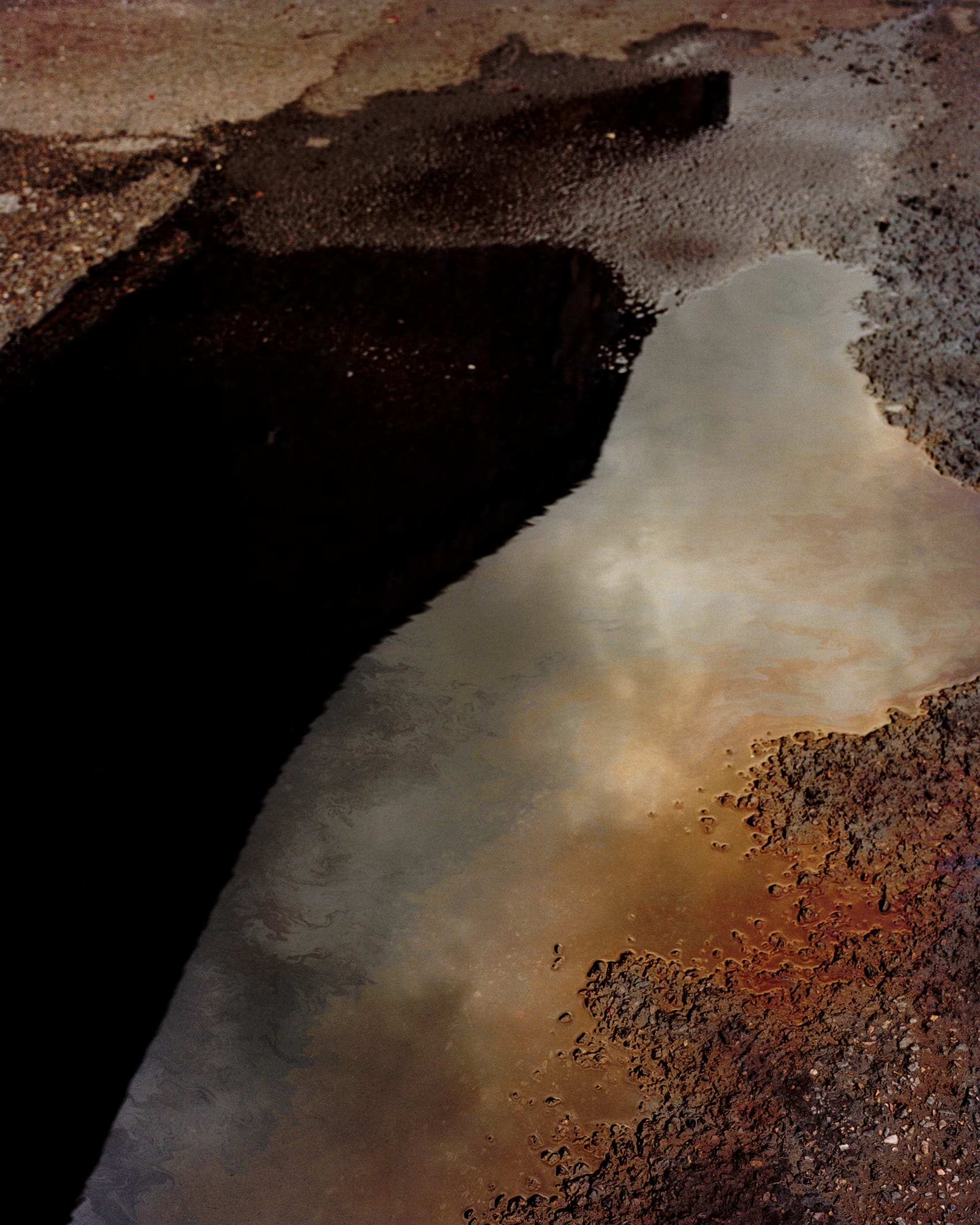 Reflection in water puddle on the street 