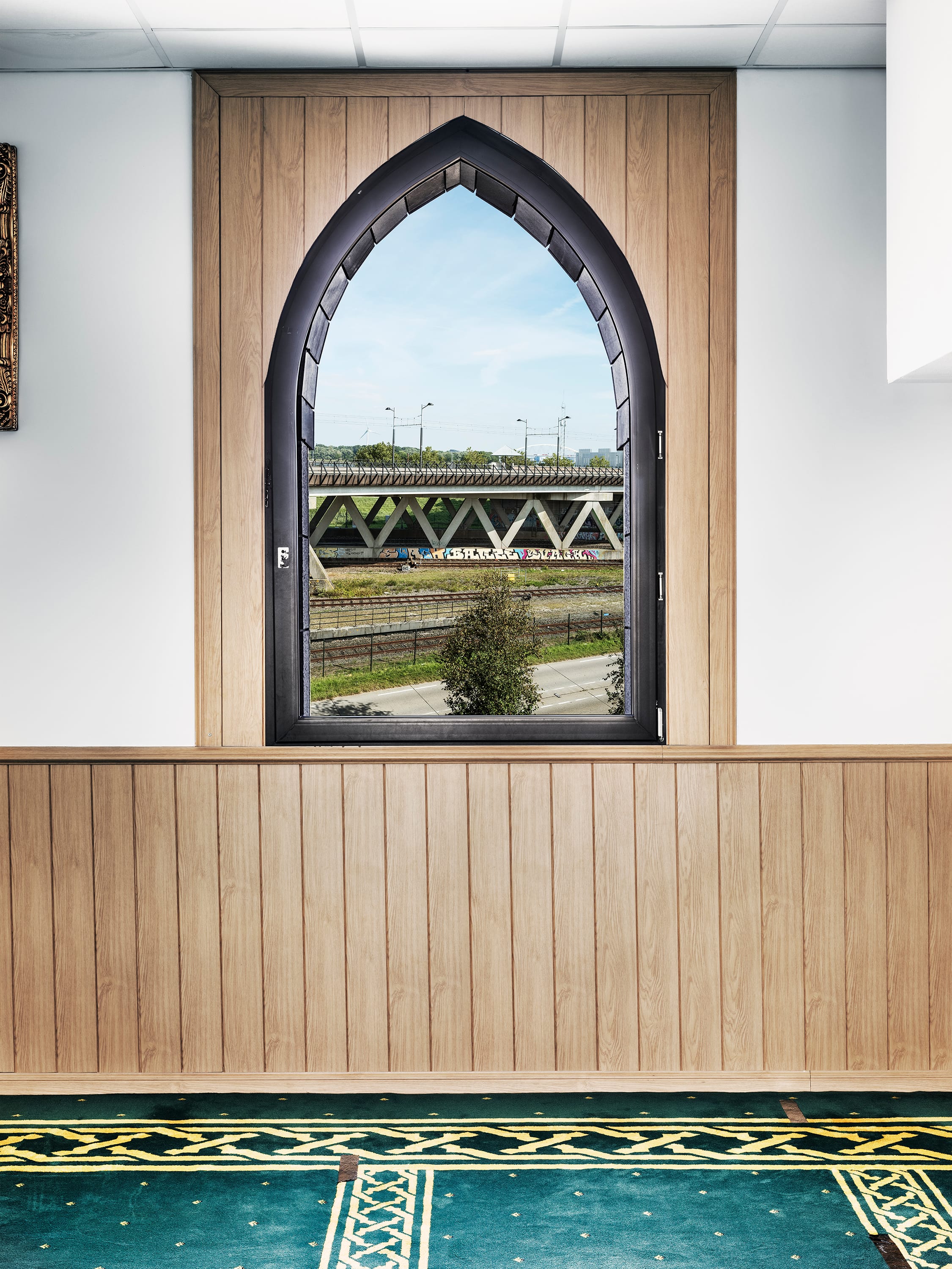 View from inside a mosque onto a Dutch landscape