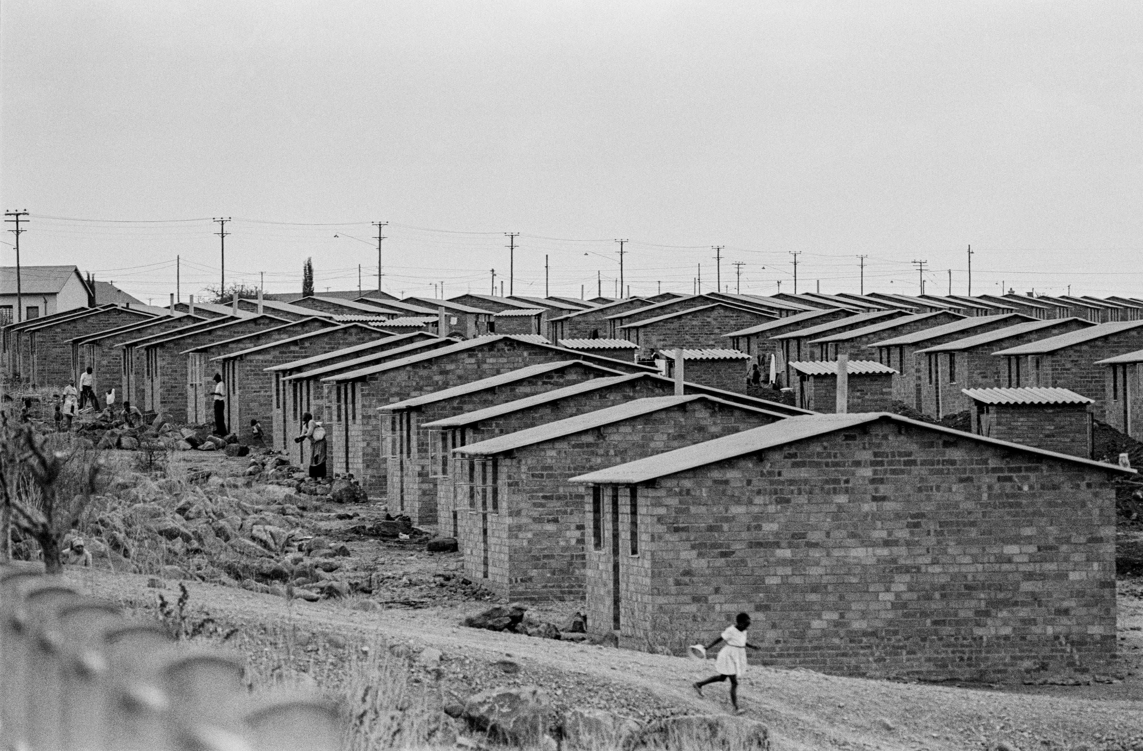 houses in a row and woman running